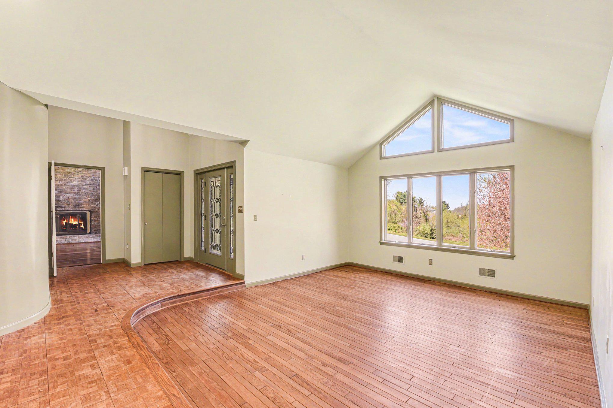 13800 Cripplegate Road Phoenix, MD 21131 - Photo 8 of 47 a view of an empty room with wooden floor and a window
