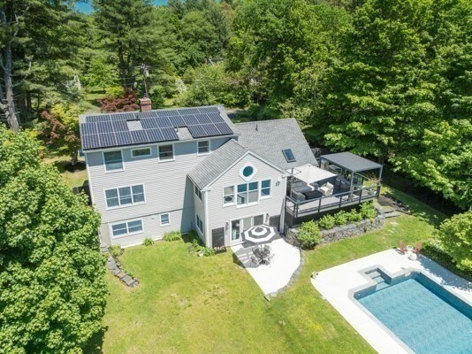 585 Station Road Amherst, MA 01002 - Photo 38 of 42 aerial view of a house with a big yard plants and large trees