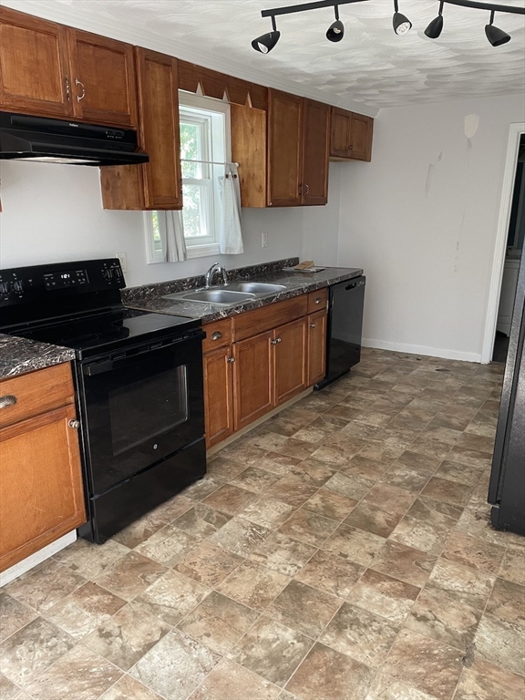 48 County Road Andover, MA 01810 - Photo 10 of 15 a kitchen with stainless steel appliances granite countertop a stove a sink and a microwave