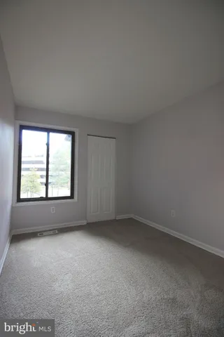 a bathroom with a bathtub and a toilet