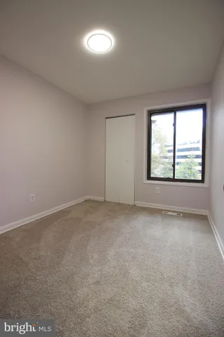 a view of an empty room and entryway