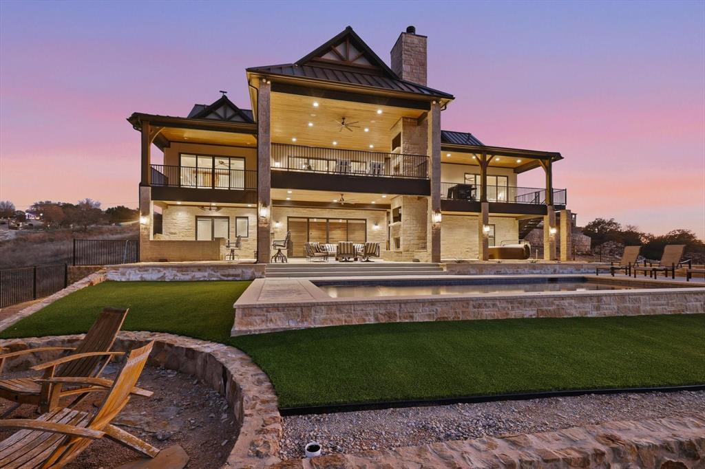 7105 West Hells Gate Drive Strawn, TX 76475 - Photo 2 of 39 a front view of a house with a yard