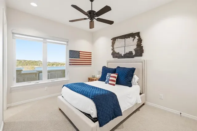 a bedroom with a large bed and a window