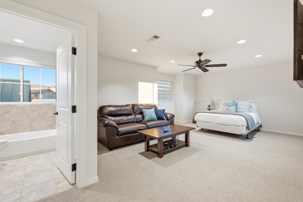 7105 West Hells Gate Drive Strawn, TX 76475 - Photo 28 of 39 a living room with furniture and a wooden floor