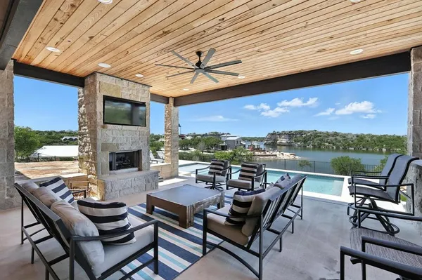 a view of a patio with a dining table and chairs
