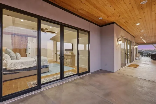 a view of an empty room and a balcony