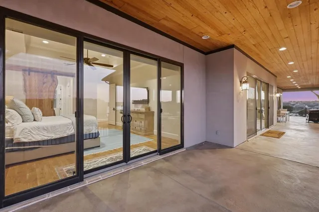 a view of an empty room and a balcony