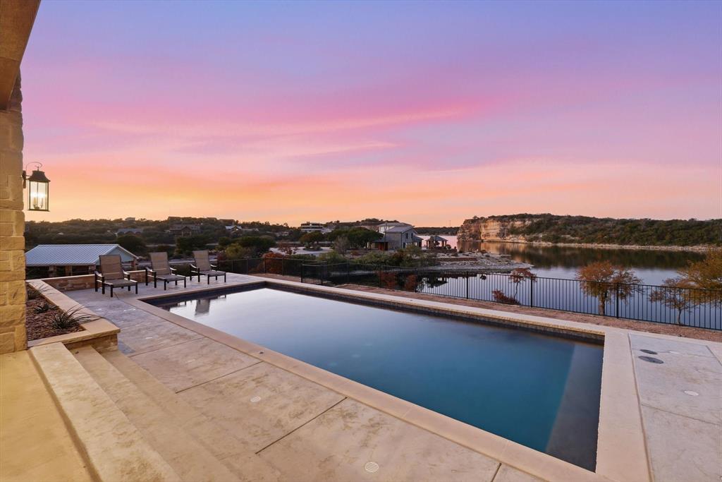 7105 West Hells Gate Drive Strawn, TX 76475 - Photo 35 of 39 a view of a swimming pool from a terrace