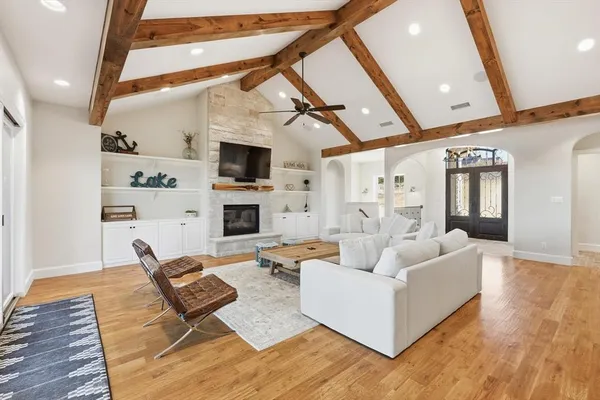 a living room with fireplace furniture and a flat screen tv