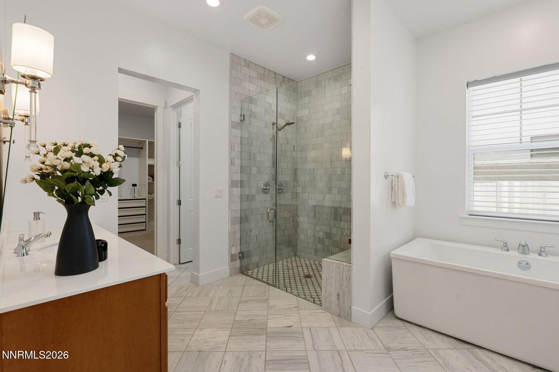 6110 South Pleasant Oak Trail Reno, NV 89511 - Photo 22 of 66 a bathroom with a sink a toilet and shower