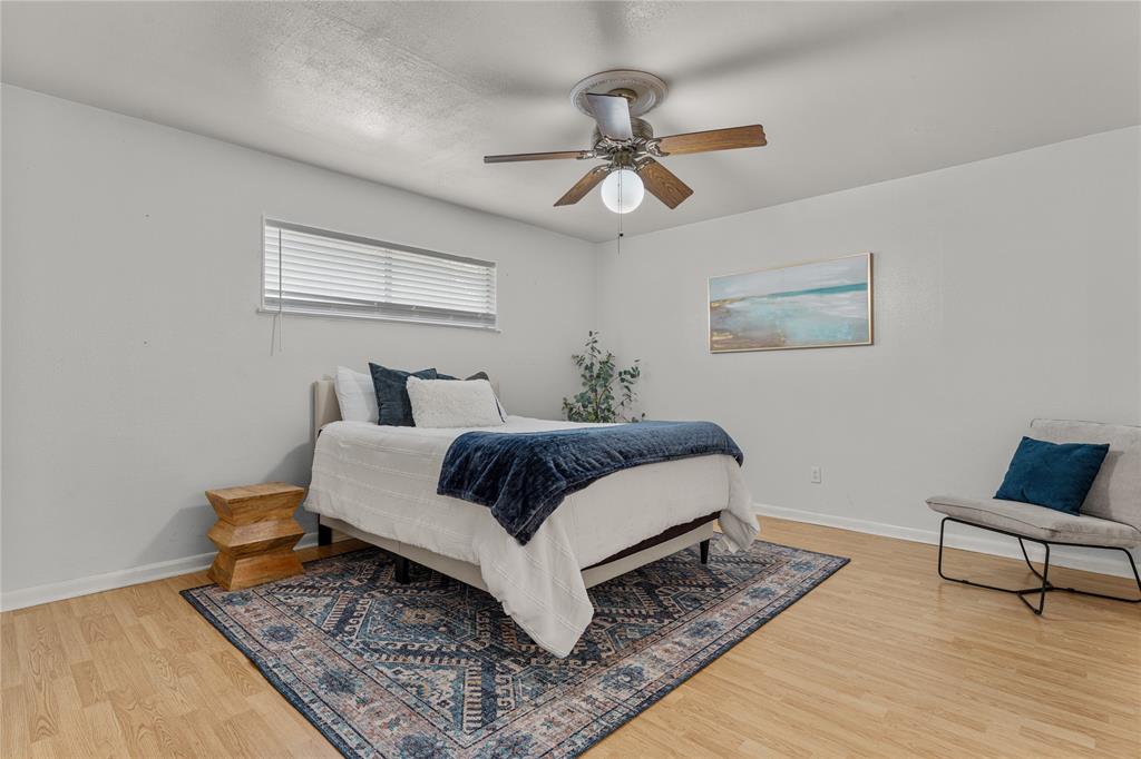 2612 Glendale Drive Waco, TX 76708 - Photo 14 of 38 Bedroom with light wood-style flooring and ceiling fan