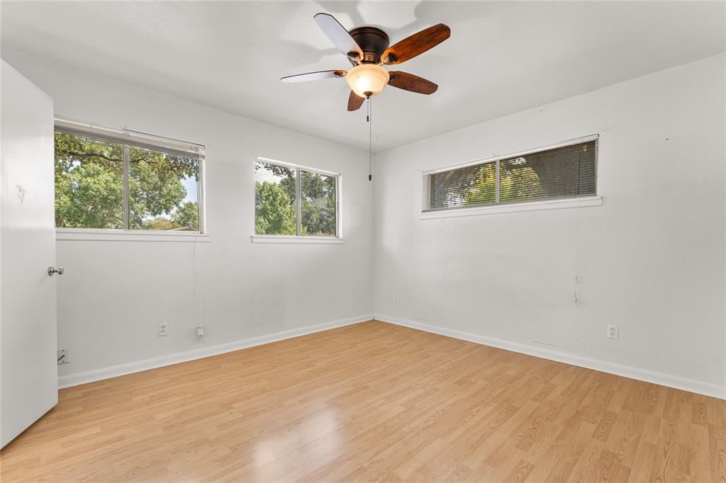 2612 Glendale Drive Waco, TX 76708 - Photo 16 of 38 Unfurnished room featuring light wood-style flooring and ceiling fan