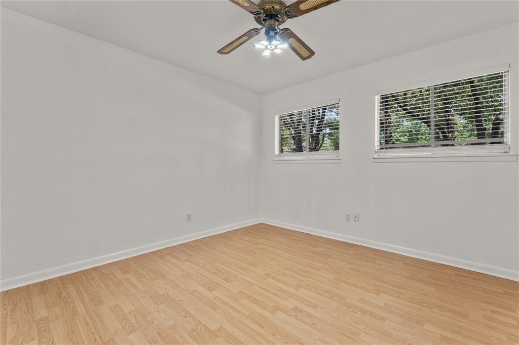 2612 Glendale Drive Waco, TX 76708 - Photo 21 of 38 Spare room featuring light wood-type flooring and a ceiling fan