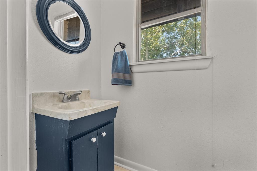 2612 Glendale Drive Waco, TX 76708 - Photo 25 of 38 Bathroom featuring vanity and a textured wall