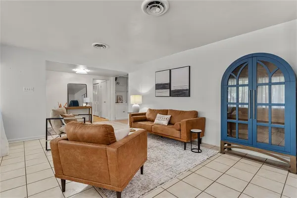 a living room with furniture and a window