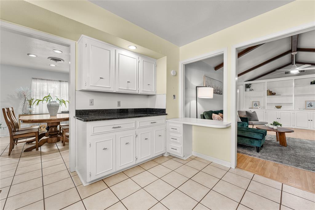 2612 Glendale Drive Waco, TX 76708 - Photo 37 of 38 Kitchen with white cabinetry, light tile patterned floors, dark stone counters, open floor plan, and recessed lighting