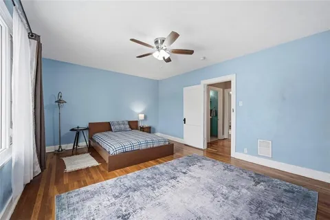 a room with pool and wooden floor