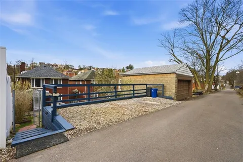 an aerial view of houses with outdoor space