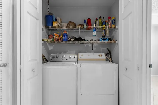 a utility room with dryer and washer