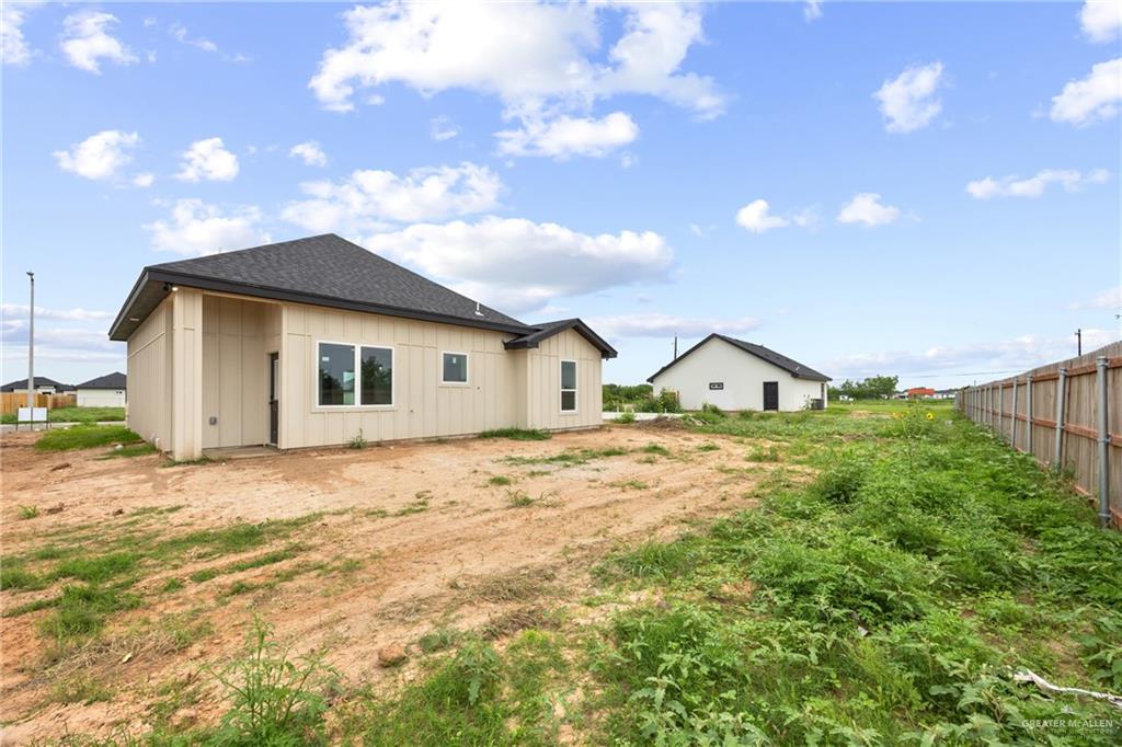 3610 Satelite Street Edinburg, TX 78542 - Photo 15 of 22 a view of a house with a patio and yard