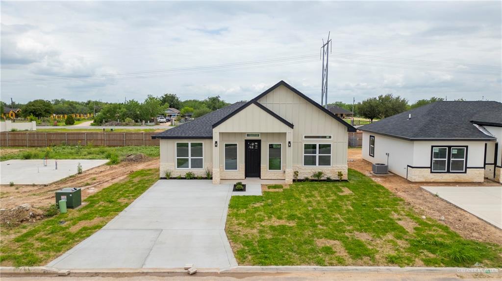 3610 Satelite Street Edinburg, TX 78542 - Photo 16 of 22 a view of a house with a yard potted plants and a table