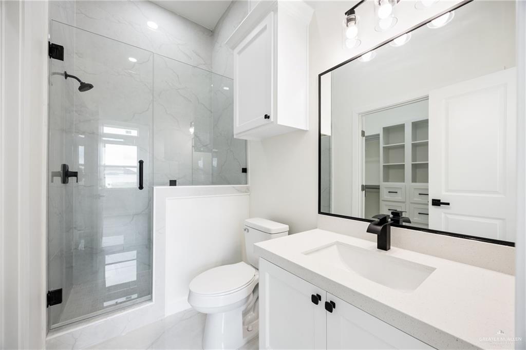 3610 Satelite Street Edinburg, TX 78542 - Photo 10 of 22 a bathroom with a sink a toilet and shower