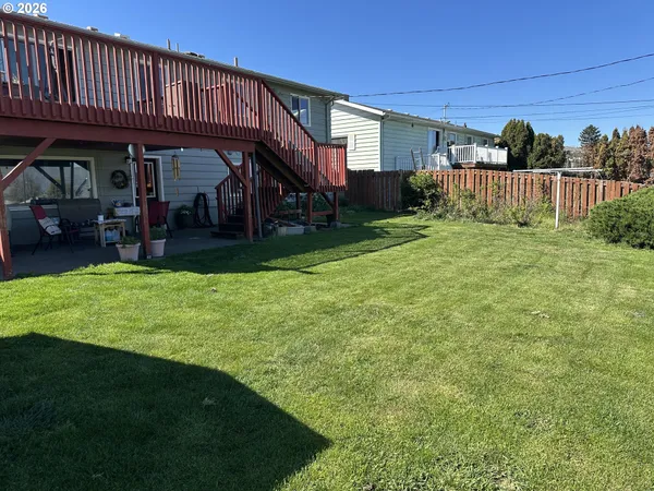a view of a house with a yard porch and sitting area