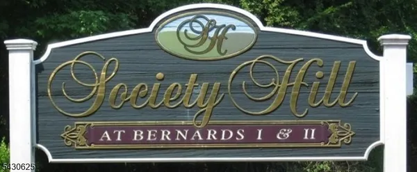 a sign that is on a brick wall
