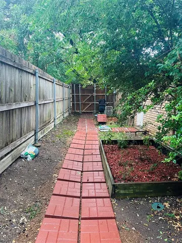 a kitchen with a dining table chairs and white appliances
