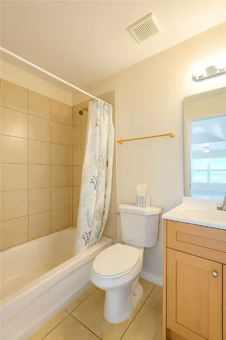 a bathroom with a toilet a sink and a bathtub