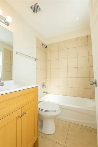 a bathroom with a toilet a sink and bathtub