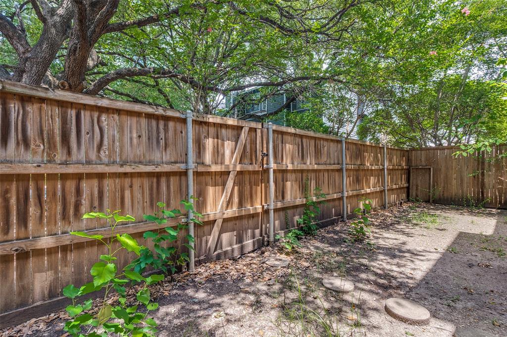 5840 Spring Valley Road, Unit 803 Dallas, TX 75254 - Photo 11 of 12 Backyard with wood fence is perfect for outdoor entertainment.