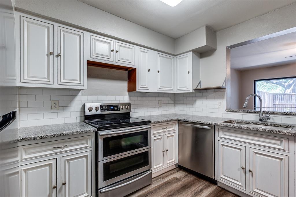 5840 Spring Valley Road, Unit 803 Dallas, TX 75254 - Photo 3 of 12 Large kitchen features granite counter tops, stainless steel appliances, under mount sink, pantry and abundant of counter space. and cabinets.
