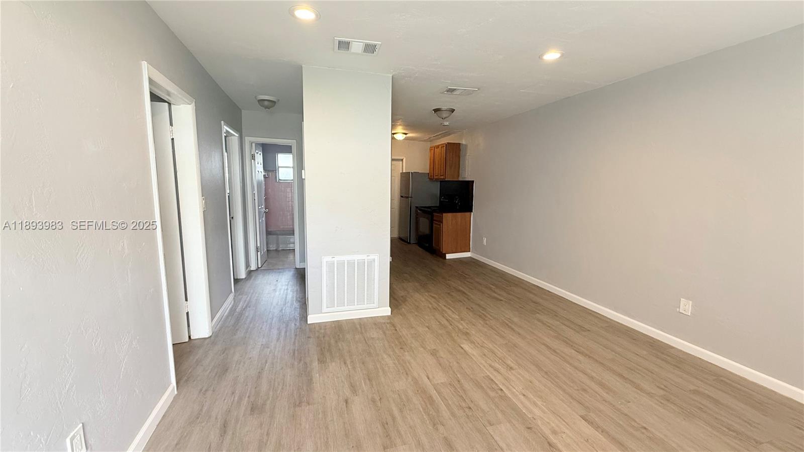 337 Northeast 57th Street, Unit 2 Miami, FL 33137 - Photo 4 of 9 a view of hallway with wooden floor