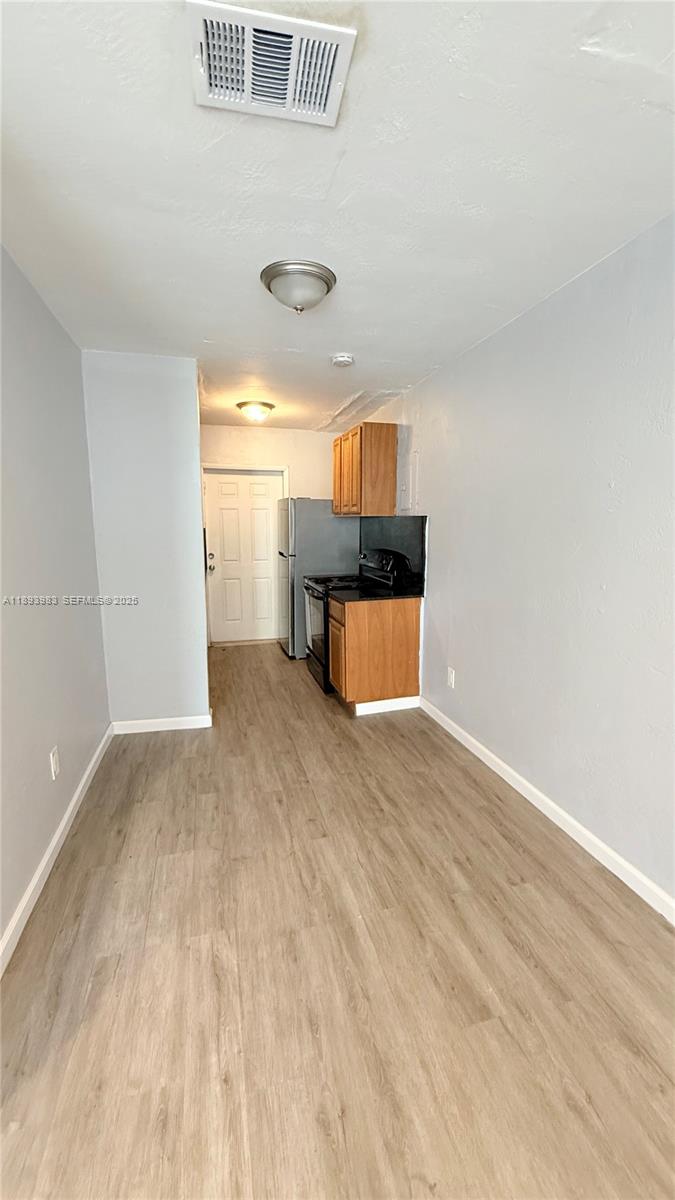 337 Northeast 57th Street, Unit 2 Miami, FL 33137 - Photo 7 of 9 a view of a room with a sink and a window
