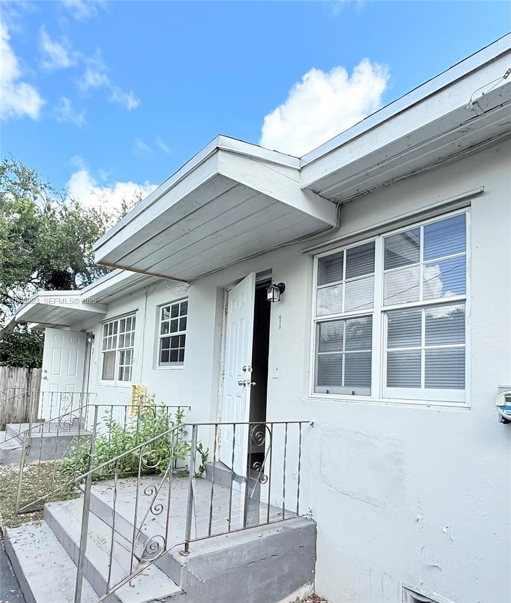 337 Northeast 57th Street, Unit 2 Miami, FL 33137 - Photo 9 of 9 a front view of a house with a large window