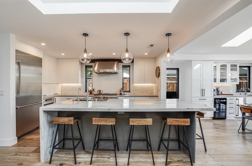 2354 Marr Lane San Jose, CA 95124 - Photo 32 of 55 a kitchen with stainless steel appliances kitchen island granite countertop a table chairs stove and cabinets