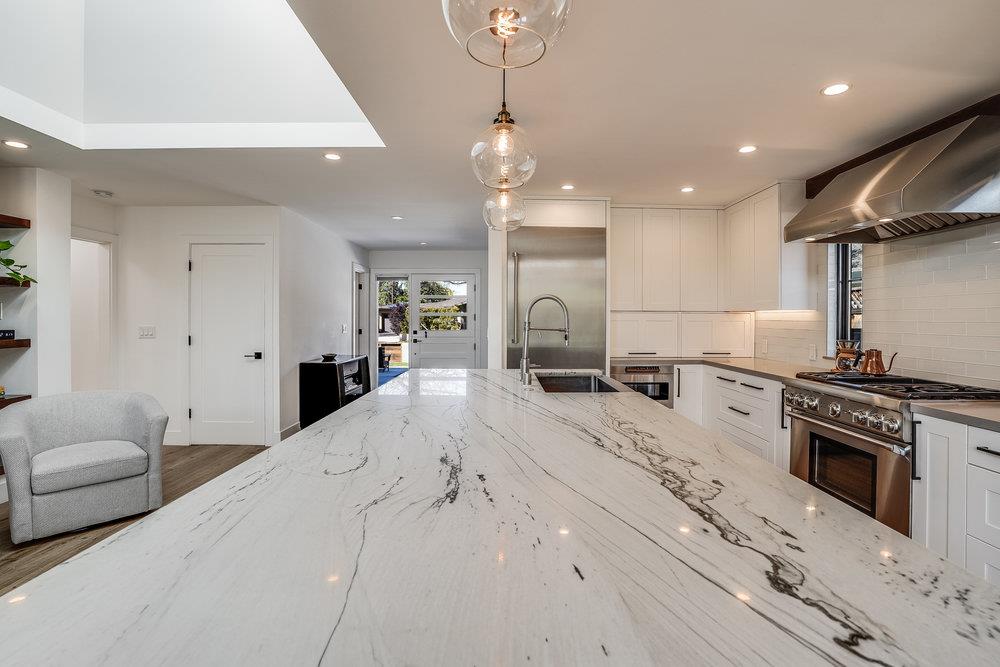 2354 Marr Lane San Jose, CA 95124 - Photo 35 of 55 a large kitchen with stainless steel appliances kitchen island granite countertop a sink a stove and a refrigerator