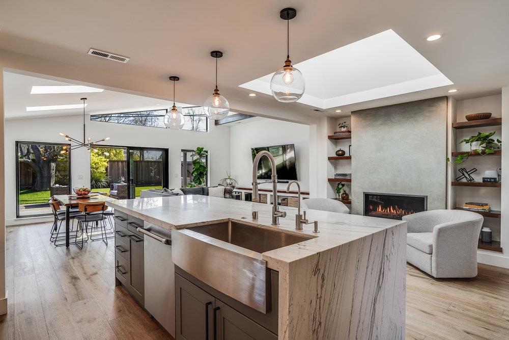 2354 Marr Lane San Jose, CA 95124 - Photo 36 of 55 a kitchen with a sink a counter top space a dining table a fireplace and a large window