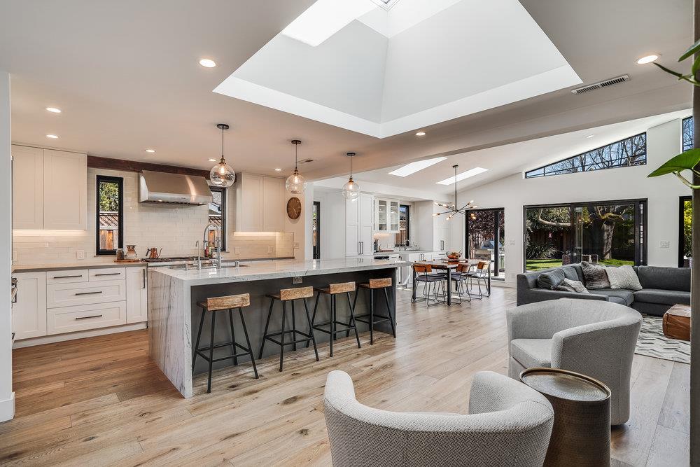 2354 Marr Lane San Jose, CA 95124 - Photo 39 of 55 a dining hall with stainless steel appliances kitchen island granite countertop a table chairs and a living room view