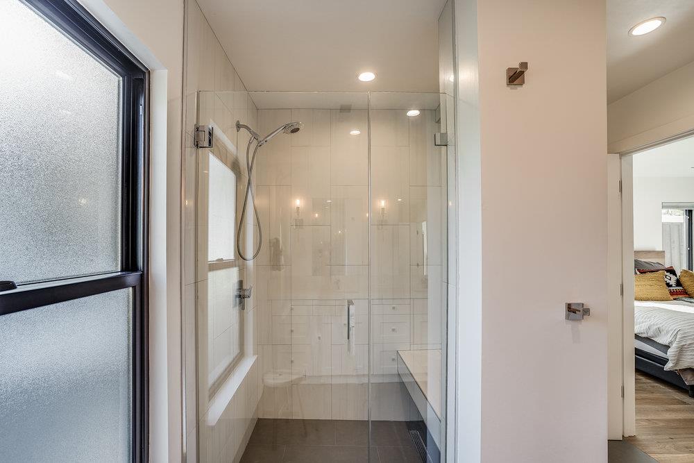 2354 Marr Lane San Jose, CA 95124 - Photo 42 of 55 a bathroom with a glass shower door