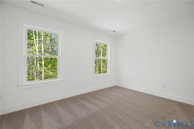 a view of balcony with wooden floor