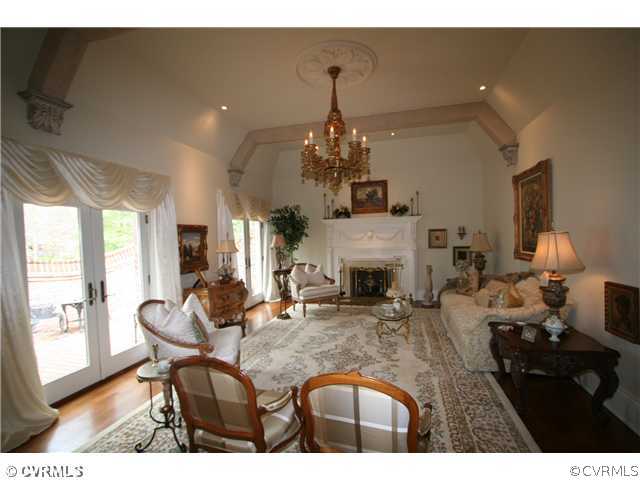 Living Room - Antique mantle and chandelier. Two s