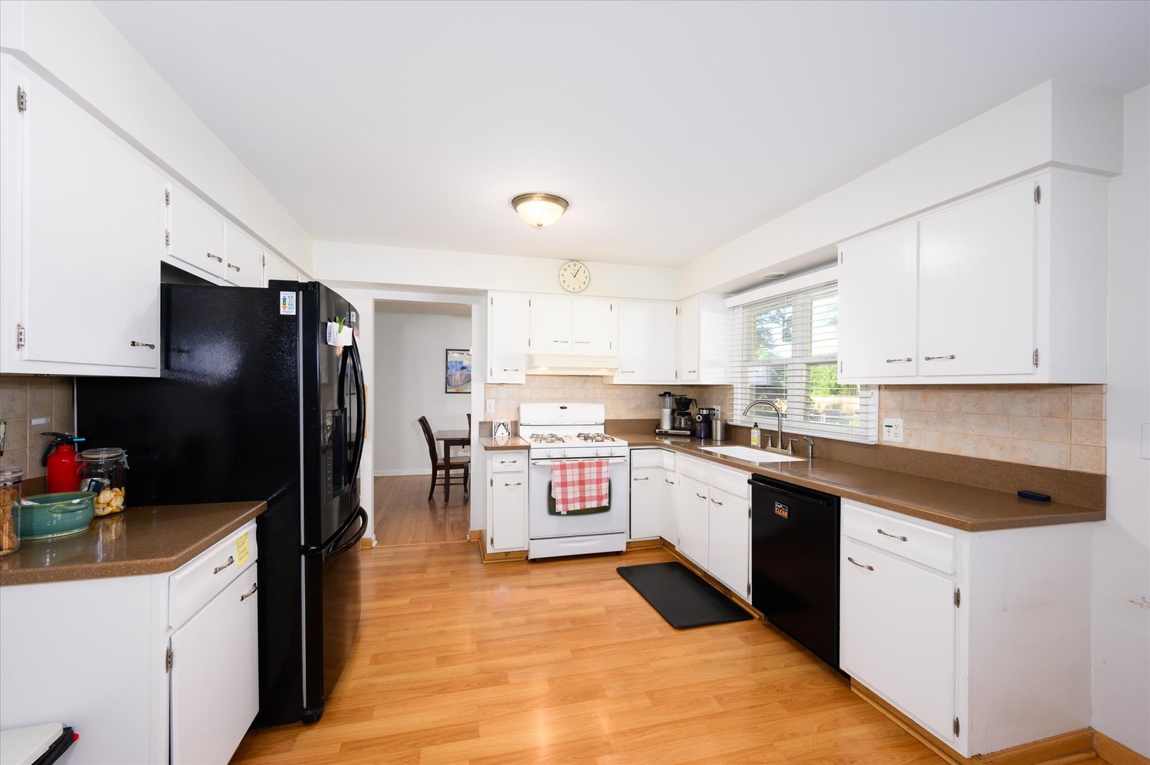 1709 Kay Road Wheaton, IL 60187 - Photo 11 of 37 a kitchen with granite countertop a refrigerator stove top oven and sink