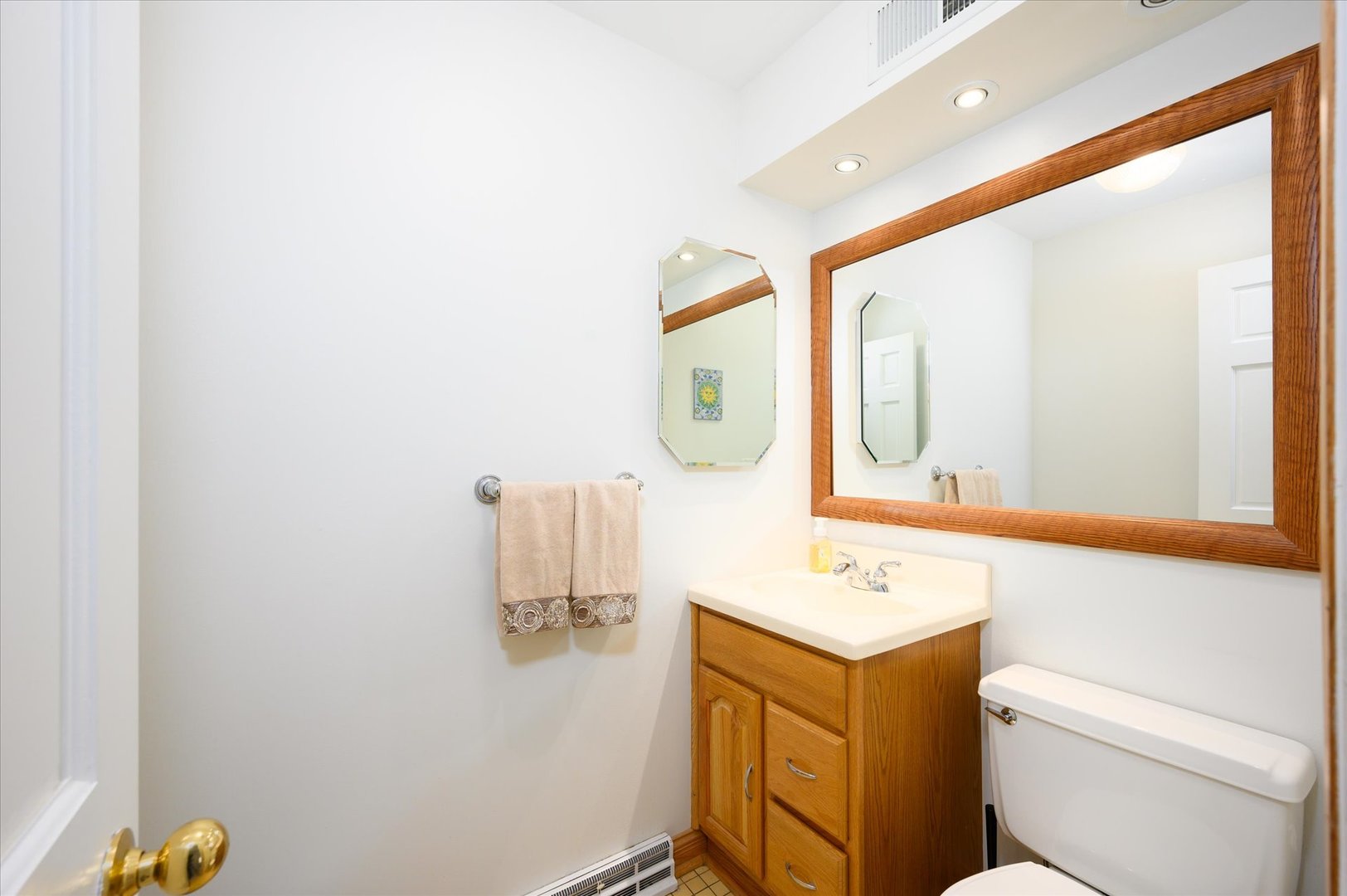 1709 Kay Road Wheaton, IL 60187 - Photo 16 of 37 a bathroom with a sink vanity mirror and toilet