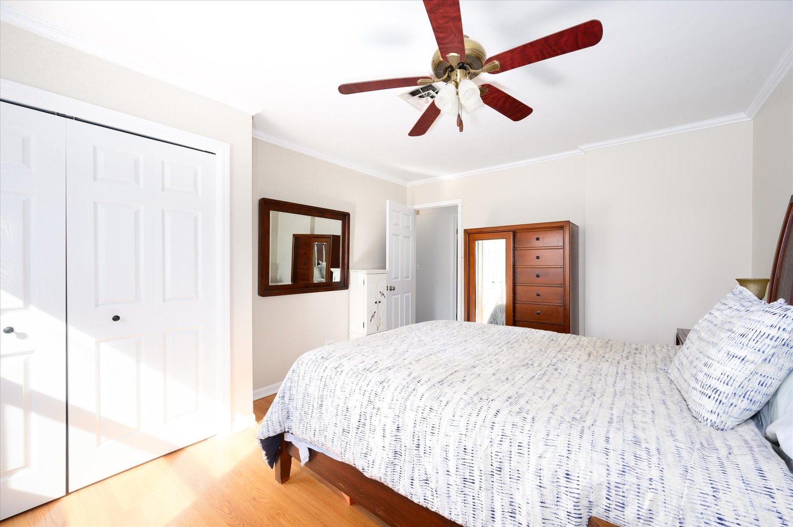1709 Kay Road Wheaton, IL 60187 - Photo 17 of 37 a bedroom with a large bed and a chandelier fan