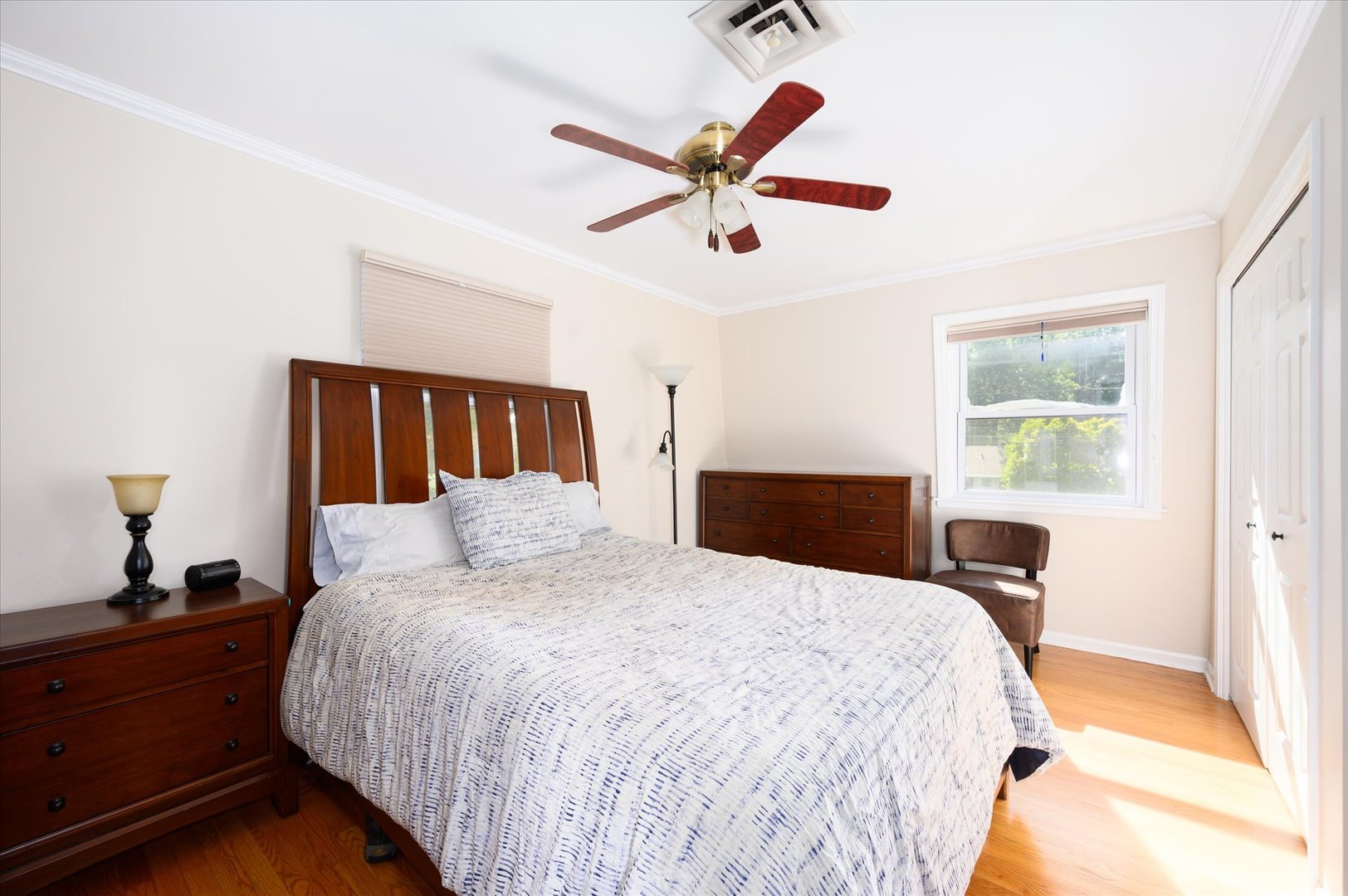 1709 Kay Road Wheaton, IL 60187 - Photo 18 of 37 a bedroom with a large bed and a chandelier