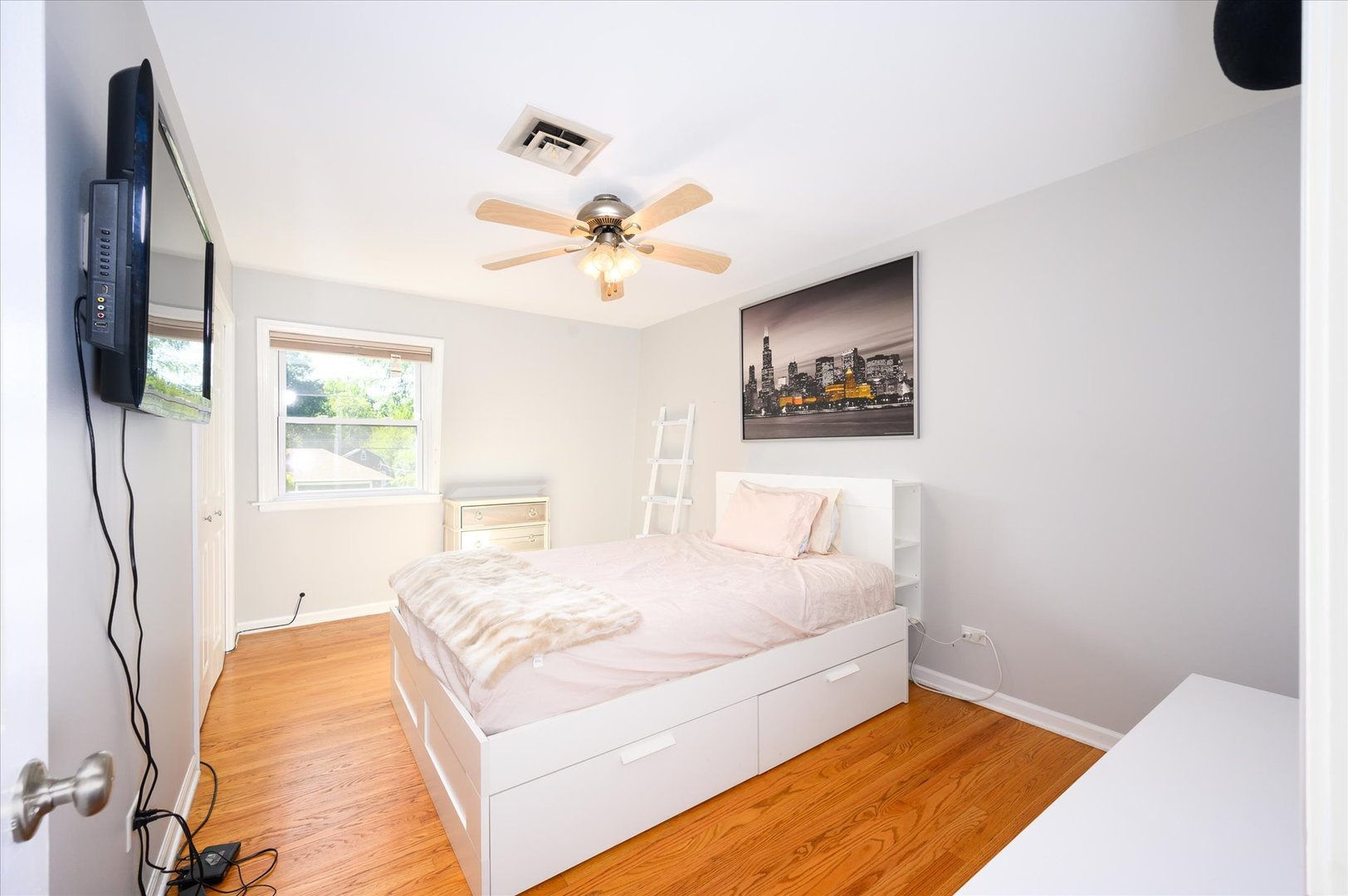 1709 Kay Road Wheaton, IL 60187 - Photo 22 of 37 a bedroom with a bed and a chandelier