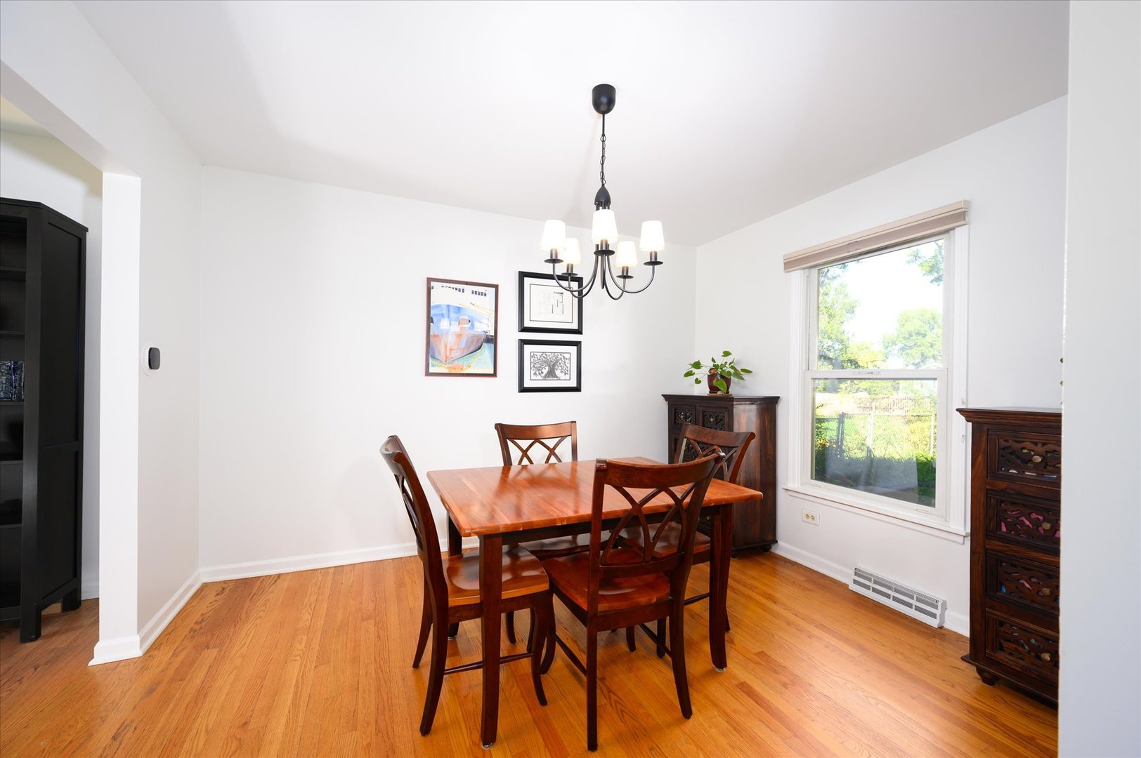 1709 Kay Road Wheaton, IL 60187 - Photo 10 of 37 a view of a dining room with furniture window and wooden floor