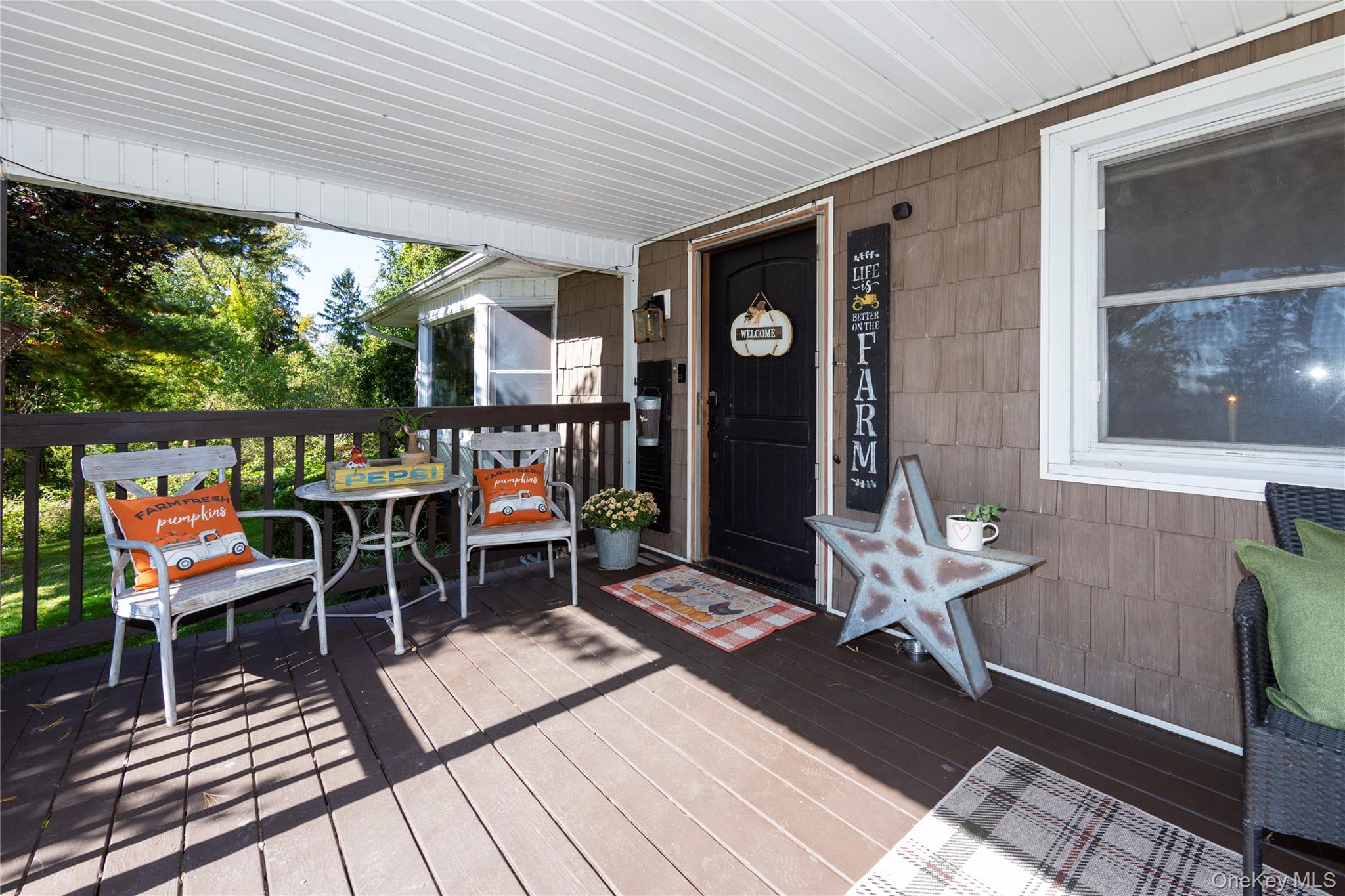 39 Birch Hill Road Patterson, NY 12563 - Photo 37 of 44 Start your mornings with coffee on the covered front porch.